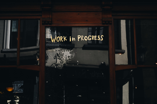 Work in progress sign on dark background